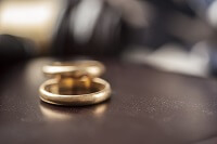 Wedding rings on a table in a contested divorce case